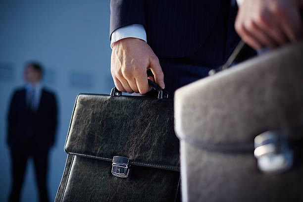 Business professionals with briefcases, emphasizing the corporate environment for starting a company in Dubai.