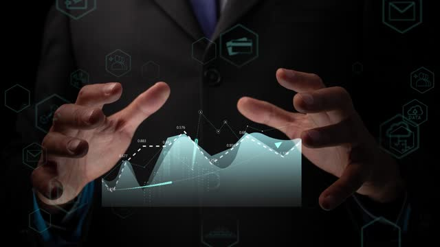 A businessman visualizes financial growth charts, symbolizing DMCC Dubai's support for SMEs.